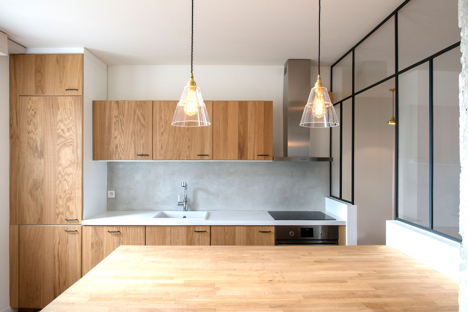 This charismatic kitchen space features our Lyx clear glass pendant lights