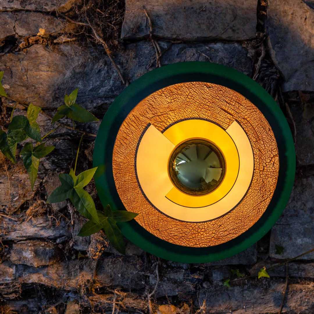 a wall light or sconce with a design inspired by the planets